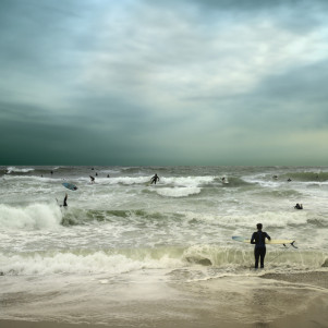 People surfing in stormy ocean